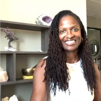 A women smiling with locks wearing a white dress A women smiling with locks wearing a white dress